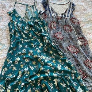 Two cute dresses size juniors medium. Floral print and bandana style print, EUC.